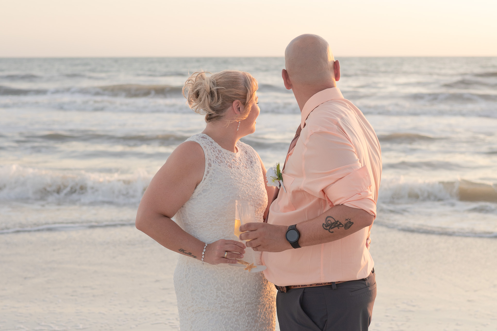 Couple laughing face-to-face in the surf