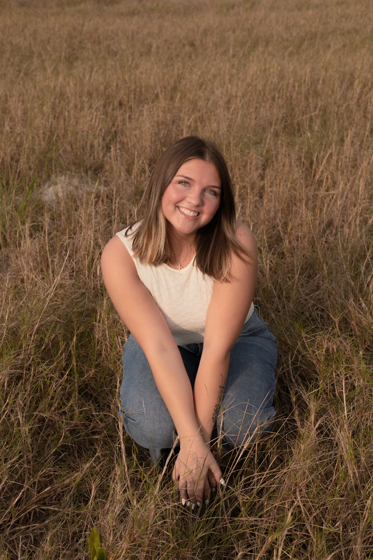Golden hour smile in a sunlit Florida field