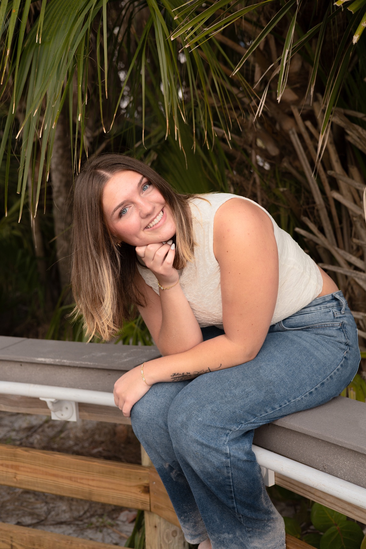 Relaxed candid on a tropical bench